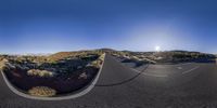 a photo taken with the fisheye lens while looking at a winding road below it