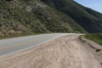 Winding Road Through Highlands and Mountains