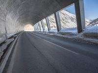 the tunnel is made up of concrete and beams it provides light and darkness, as can the snow