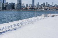 this is a cityscape view of a winter city area with buildings over the water