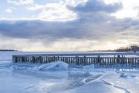 Winter Coastal Shore with Snow Pier and Ocean