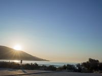 Winter Dawn on a Coastal Road: Bathed in Sunlight
