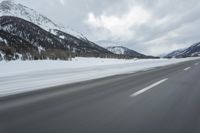 Winter Landscape in the Alps: Cloudy Sky and Snowy Mountains