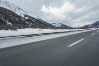 Winter Landscape in the Alps: Cloudy Sky and Snowy Mountains