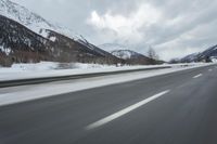 Winter Landscape in the Alps: Cloudy Sky and Snowy Mountains