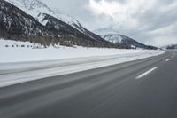 Winter Landscape in the Alps: Cloudy Sky and Snowy Mountains