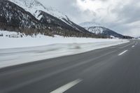 Winter Landscape in the Alps: Cloudy Sky and Snowy Mountains