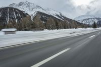 Winter Landscape in the Alps: Cloudy Sky and Snowy Mountains