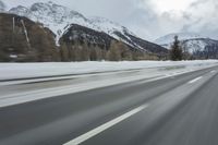 Winter Landscape in the Alps: Cloudy Sky and Snowy Mountains