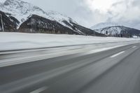 Winter Landscape in the Alps: Cloudy Sky and Snowy Mountains