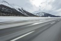 Winter Landscape in the Alps: Cloudy Sky and Snowy Mountains