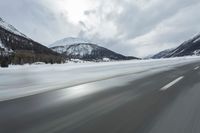 Winter Landscape in the Alps: Cloudy Sky and Snowy Mountains