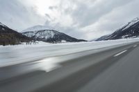 Winter Landscape in the Alps: Cloudy Sky and Snowy Mountains