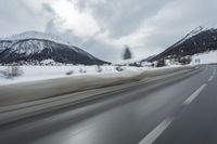 Winter Landscape in the Alps: Cloudy Sky and Snowy Mountains