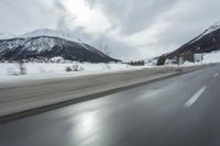 Winter Landscape in the Alps: Cloudy Sky and Snowy Mountains