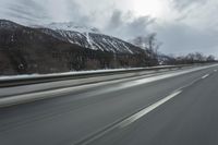 Winter Landscape in the Alps: Cloudy Sky and Snowy Mountains