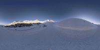 an image of the mountains in the snow with the sun beaming over them and snow covered ground