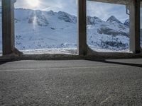 the view from under the road, looking out towards the mountains of which is covered with snow