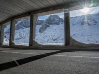 the view from under the road, looking out towards the mountains of which is covered with snow