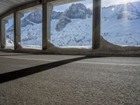 the view from under the road, looking out towards the mountains of which is covered with snow