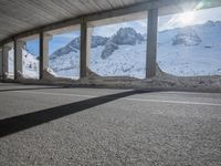 the view from under the road, looking out towards the mountains of which is covered with snow
