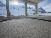 the view from under the road, looking out towards the mountains of which is covered with snow