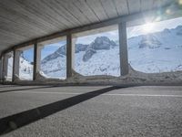 the view from under the road, looking out towards the mountains of which is covered with snow