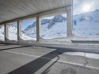 the view from under the road, looking out towards the mountains of which is covered with snow