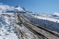 an image of winter time in the mountains by a snow bank to be used as a road