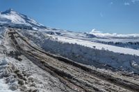 an image of winter time in the mountains by a snow bank to be used as a road