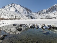Winter landscape with snow-covered mountains and lake