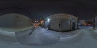 two spherical objects that are outside in the dark sky to depict winter weather and a city