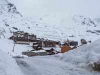 Winter Road in Residential Area of the Alps