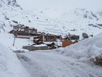 Winter Road in Residential Area of the Alps