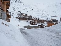 Winter Road in Residential Area of the Alps