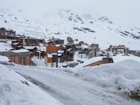 Winter Road in Residential Area of the Alps