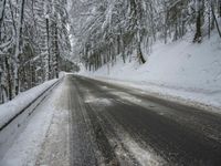 Winter Road Through Forest and Mountains