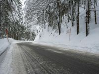 Winter Road Through Forest and Mountains