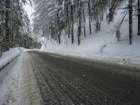 Winter Road Through Forest and Mountains