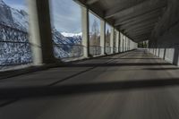 a blurry image of a road in an tunnel with rain, as viewed from the front seat of a car