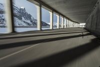 a blurry image of a road in an tunnel with rain, as viewed from the front seat of a car