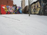 Winter Urban Scene in Detroit: Graffiti Wall and Snow-Covered Road