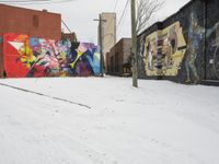 Winter Urban Scene in Detroit: Graffiti Wall and Snow-Covered Road