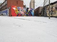 Winter Urban Scene in Detroit: Graffiti Wall and Snow-Covered Road