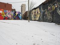 Winter Urban Scene in Detroit: Graffiti Wall and Snow-Covered Road