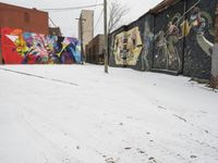 Winter Urban Scene in Detroit: Graffiti Wall and Snow-Covered Road