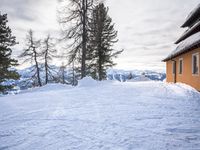 a building has been covered in some snow on the mountain side for the skiers to ski