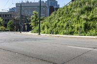 a woman riding a bicycle in an empty city road, while another one wears an oxygen vest