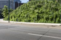 a woman riding a bicycle in an empty city road, while another one wears an oxygen vest