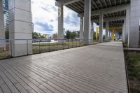 a wooden boardwalk on an empty building site for skateboarders to ride down the ramp